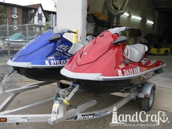 Red and Blue Yamaha waverunners completely repaired and refinished