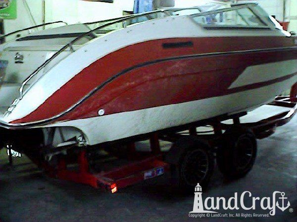 Complete exterior refinishing of a boat in process