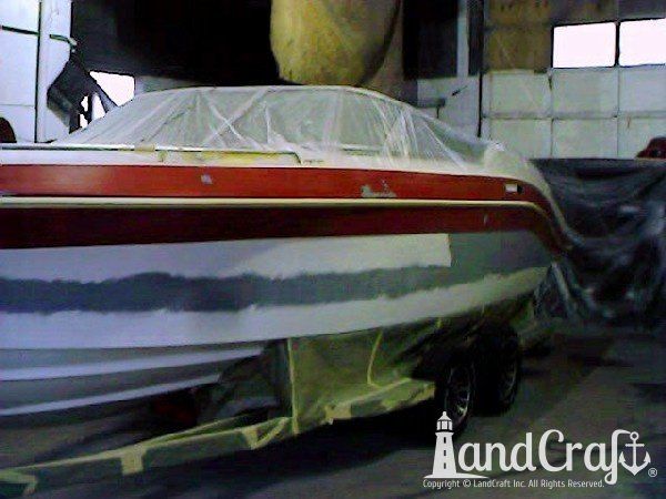 Complete exterior refinishing of a boat in process