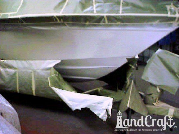 Complete exterior refinishing of a boat in process