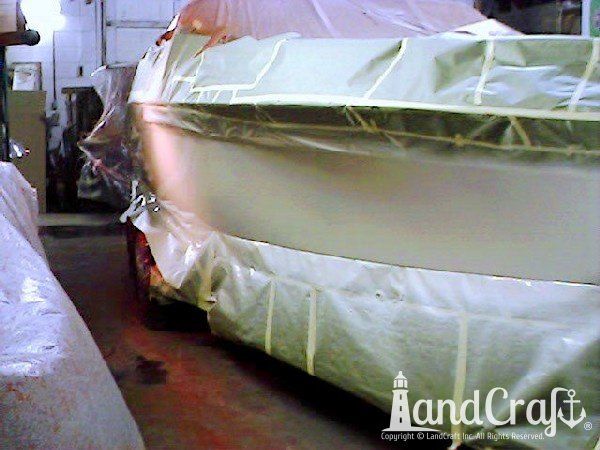 Complete exterior refinishing of a boat in process