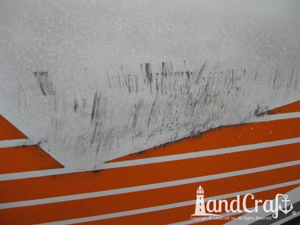 Dock Rash and scratch damage on Tige wakeboard boat