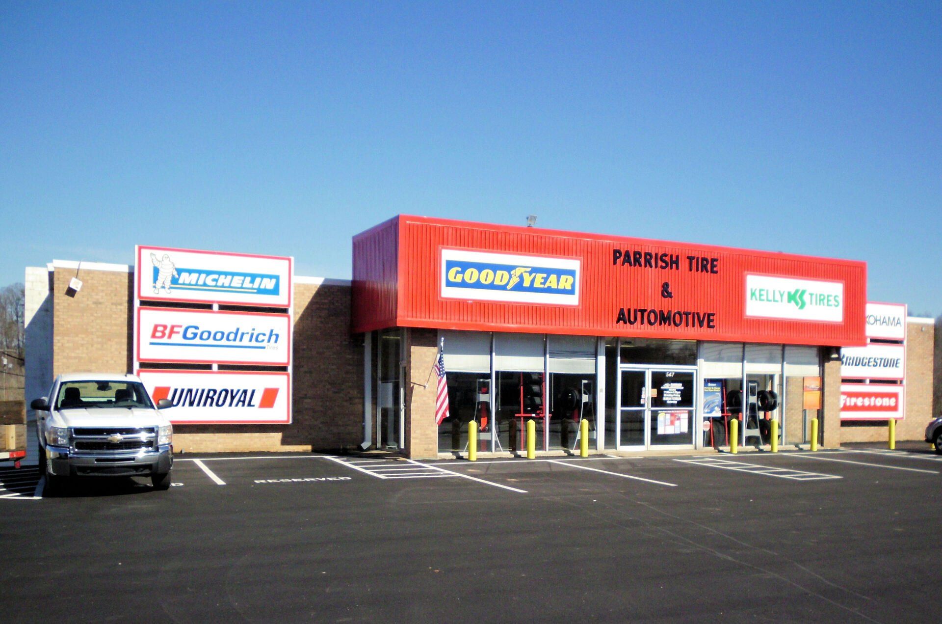 A car is parked in front of a good year store
