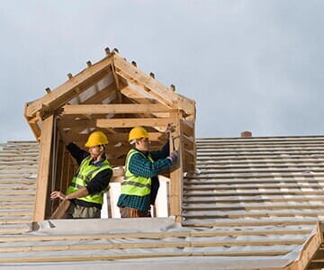 Roofing Services — Construction Workers Installing a Roof in Salt Lake City, UT Roofing Services — Construction Workers Installing a Roof in Salt Lake City, UT