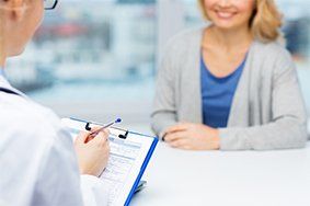 Doctor and Woman at Hospital — Health Insurance in Cambridge, MD Doctor and Woman at Hospital — Health Insurance in Cambridge, MD