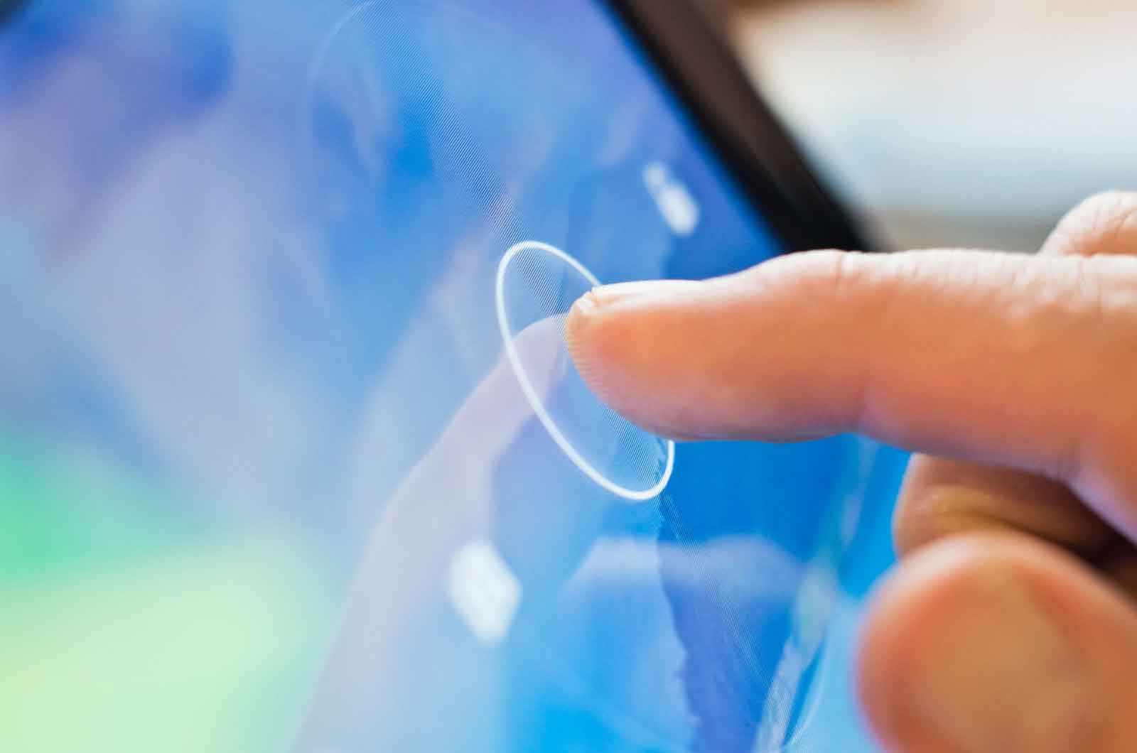 The Importance of Penmanship For Children: Someone using there finger to touch a touchscreen device.