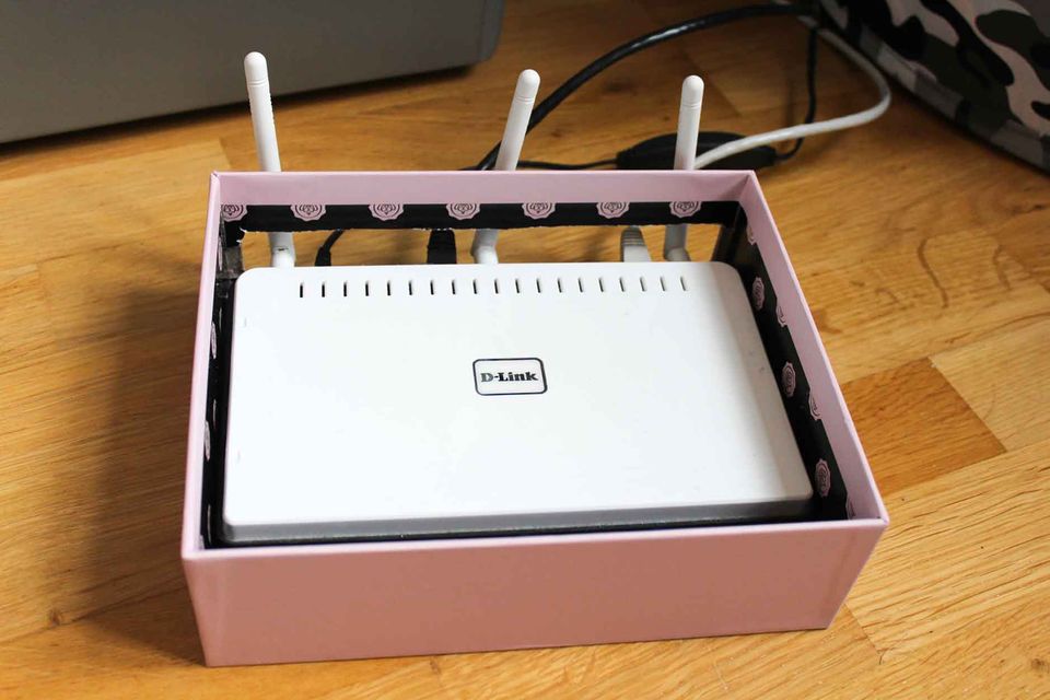 Interner router hidden in a hollowed shoe box.