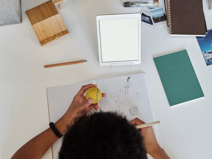 Young boy drawing at his desk