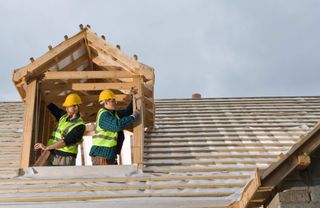 Workers working on roof - Roofing Contractors in Washington, D.C. Workers working on roof - Roofing Contractors in Washington, D.C.