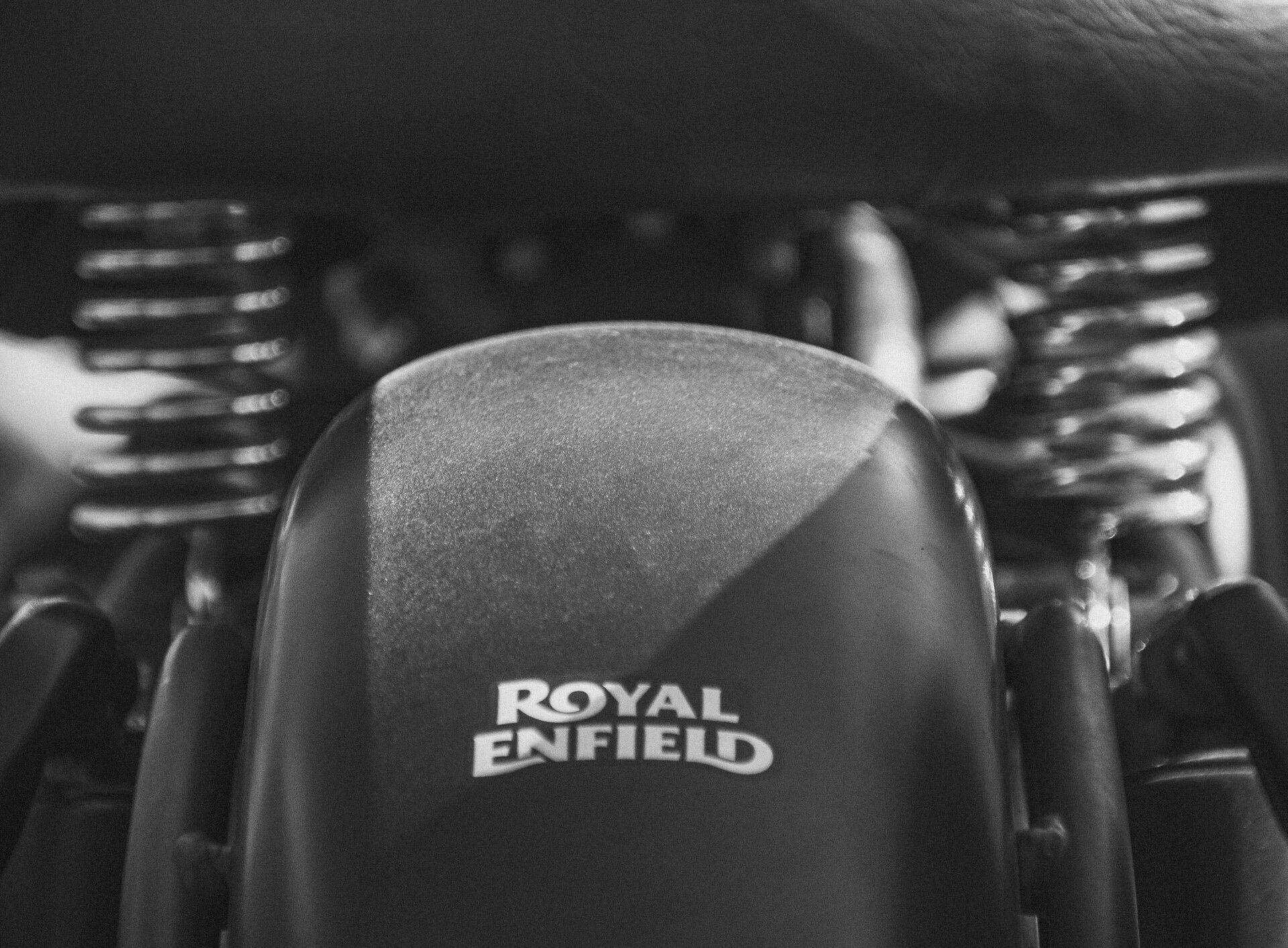 A black and white photo of a royal enfield motorcycle
