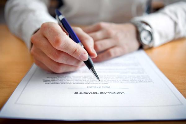 man writing his will