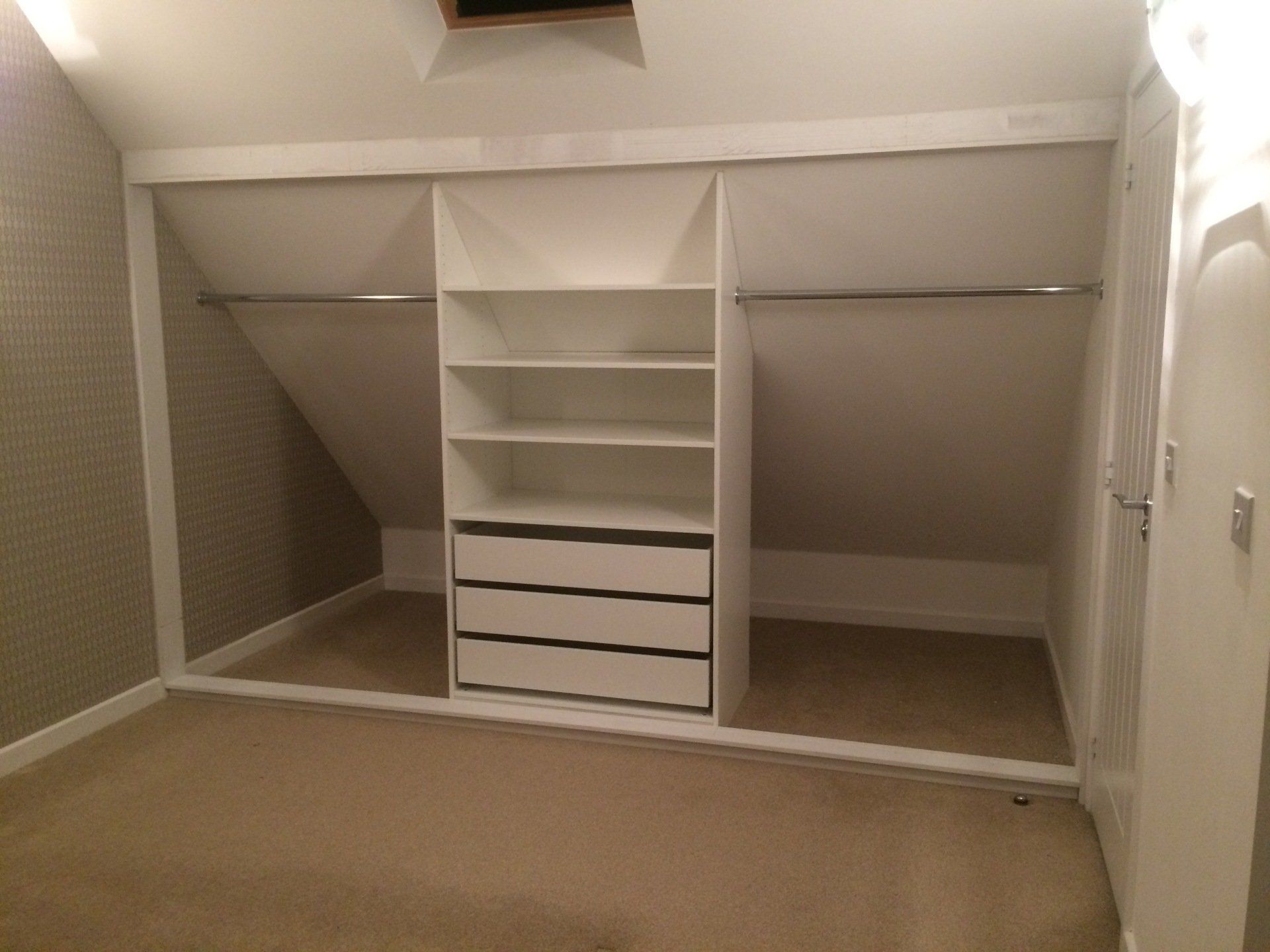 Frame for sliding doors in sloped ceiling made with Ikea carcass and soft close drawers