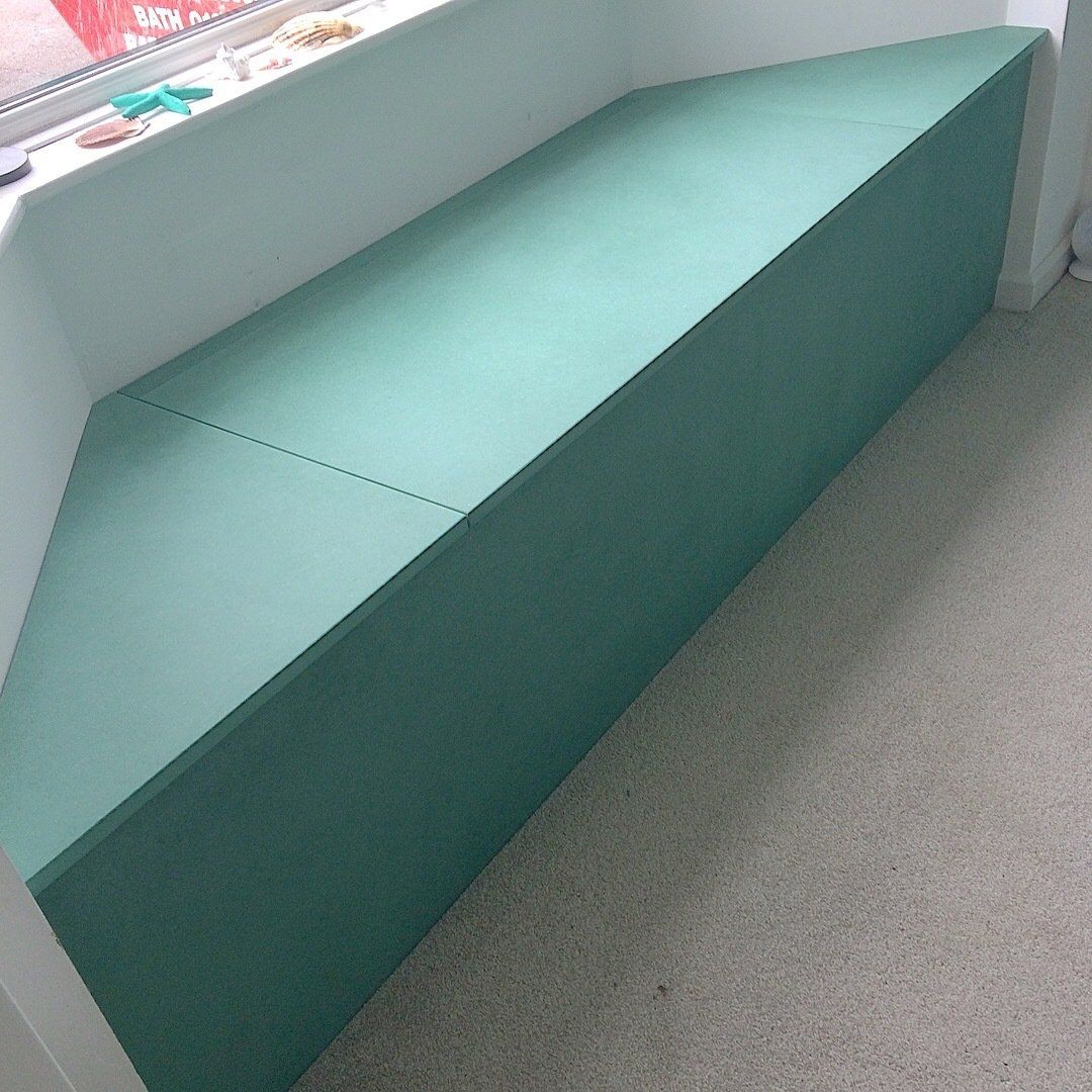 Green Valchromat bay window seat with lift up lid.