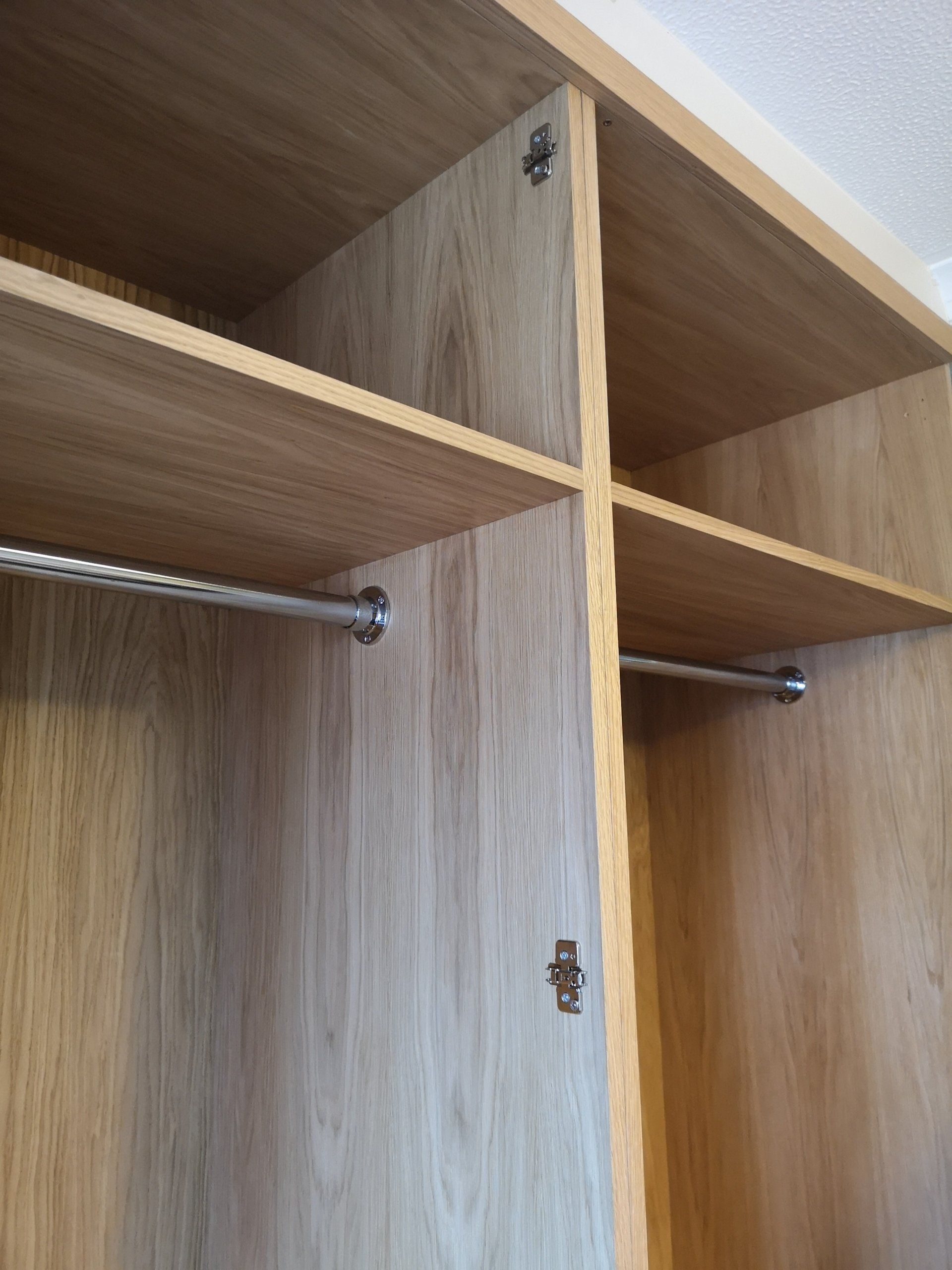 A large oak veneer bespoke wardrobe finished with Fiddes hardwax oil.
