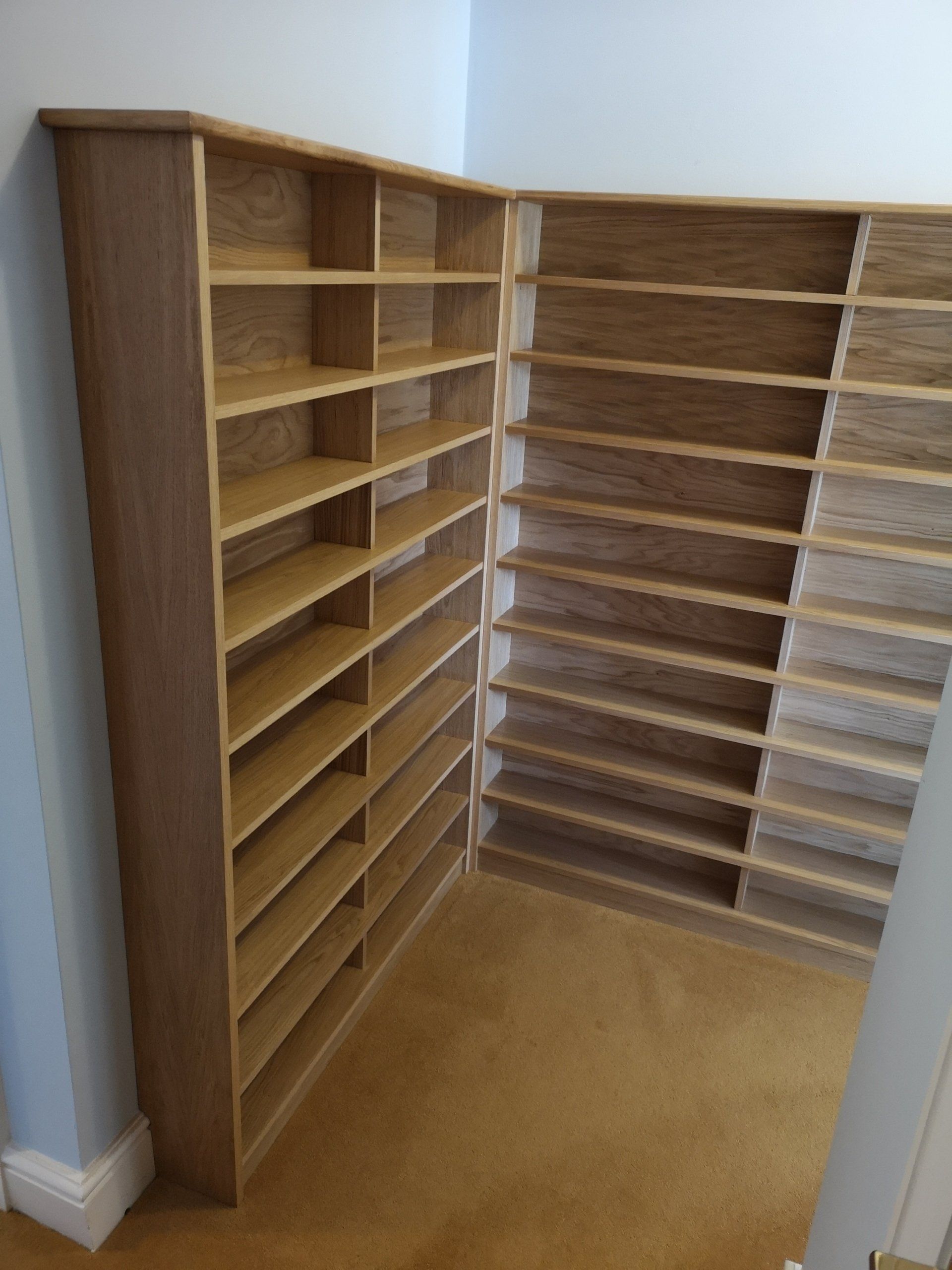 Large oak veneer CD storage corner unit. Fitted to wall and finished with Hard wax oil