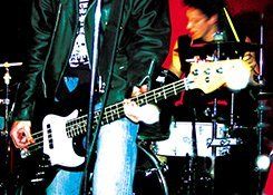 Guitarist and drummer on stage