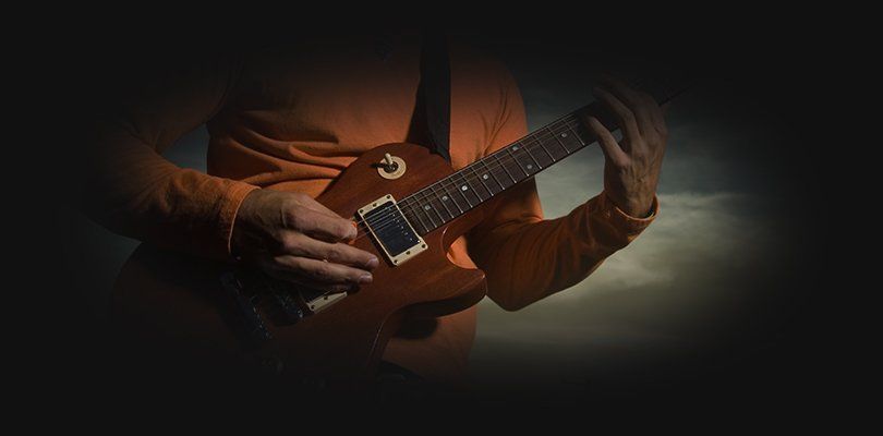A man playing bass guitar