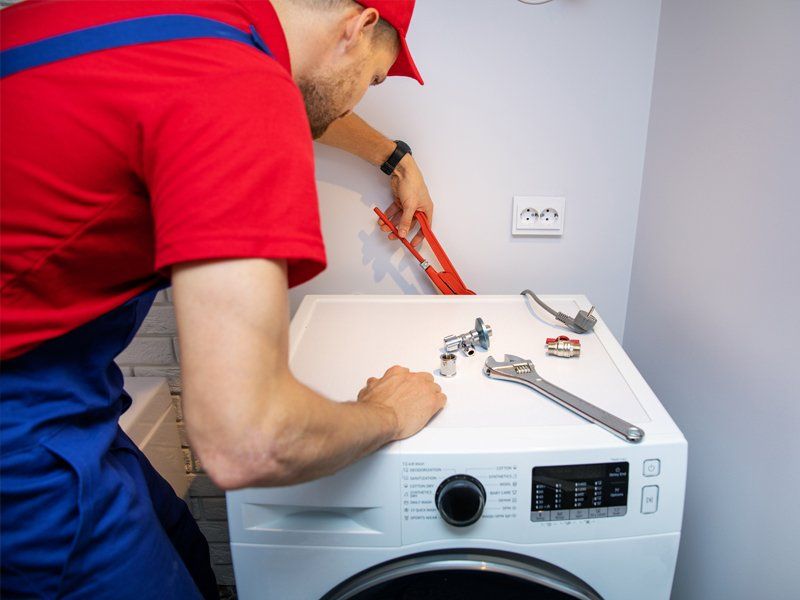 Man Repairing Appliance — Kingsport, TN — Milhorn Appliance Man Repairing Appliance — Kingsport, TN — Milhorn Appliance