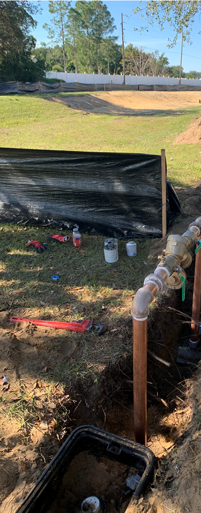 Plumber Fixing Sink Drain Pipe — Sebring, FL — Bullgator Plumbing Inc.