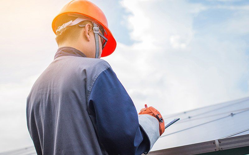 Soffits — Man Checking The Check List in Hyattsville, MD Soffits — Man Checking The Check List in Hyattsville, MD
