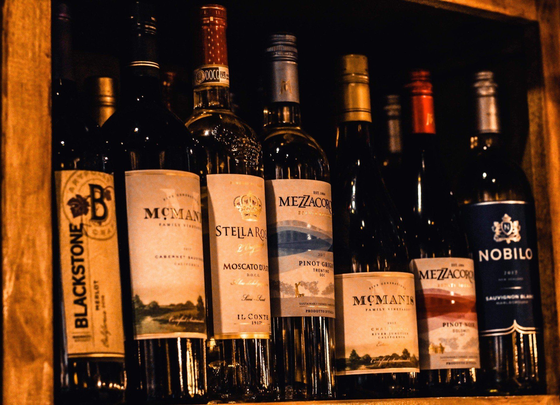 Drinks — Mojito in Chicopee, MA Wine — Bottles of wine at bar in Springfield, MA