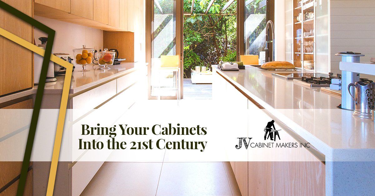 A kitchen with a lot of cabinets and a large window.
