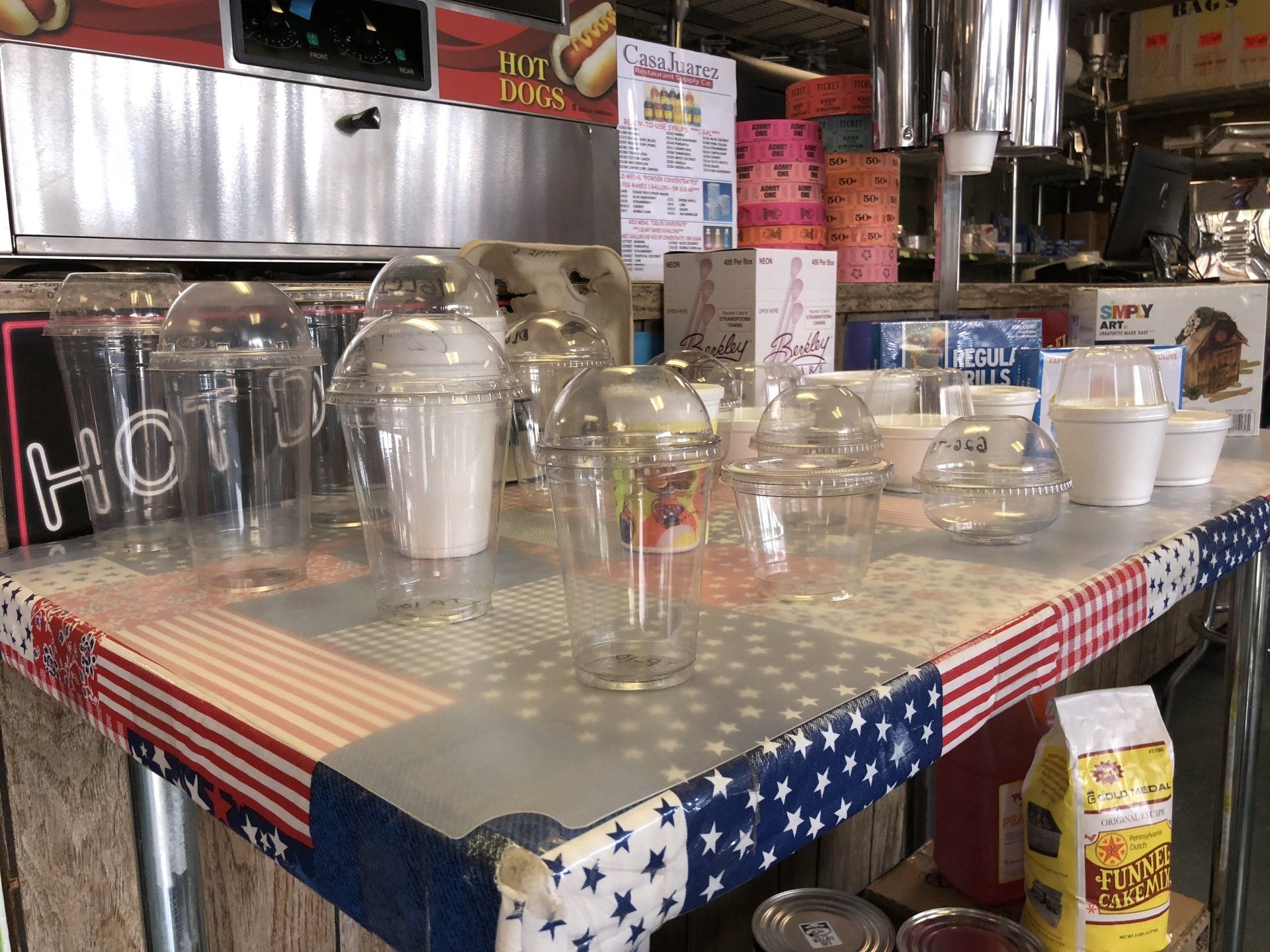 A table with a bunch of plastic cups on it