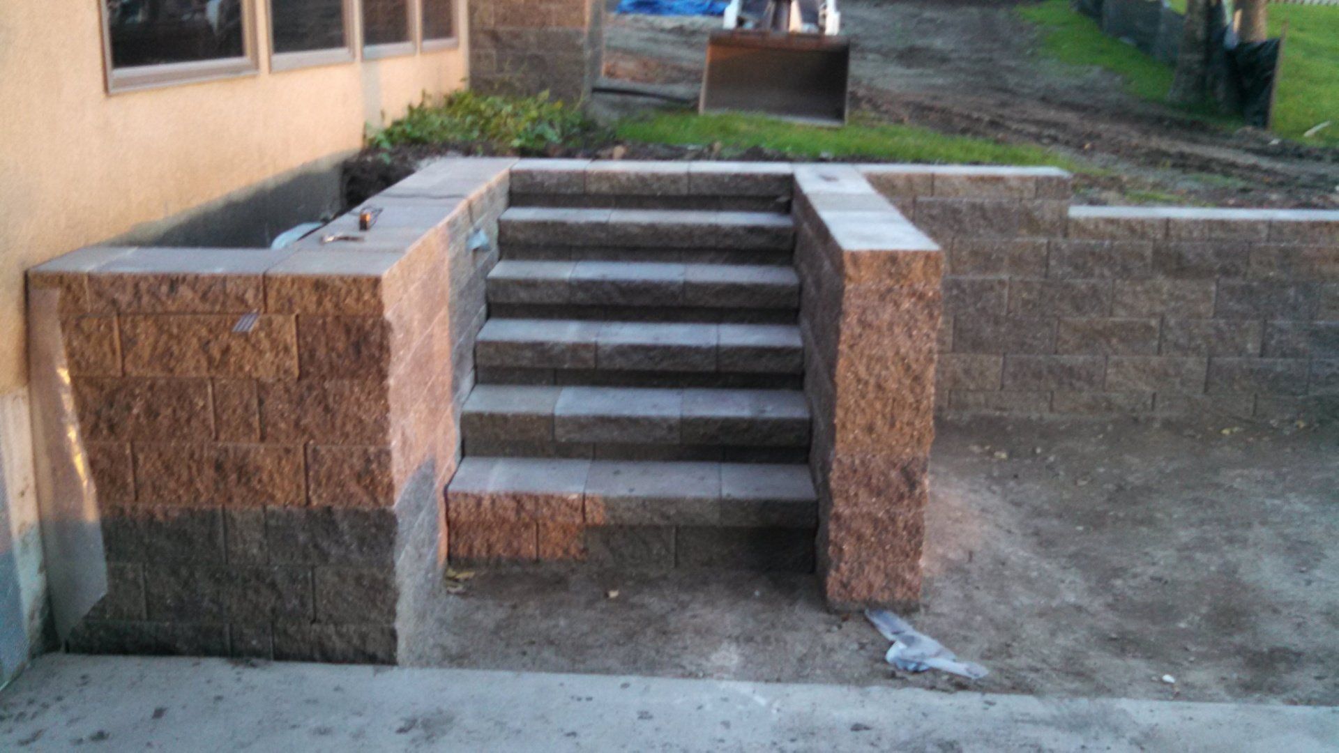 A set of stairs built into a brick wall