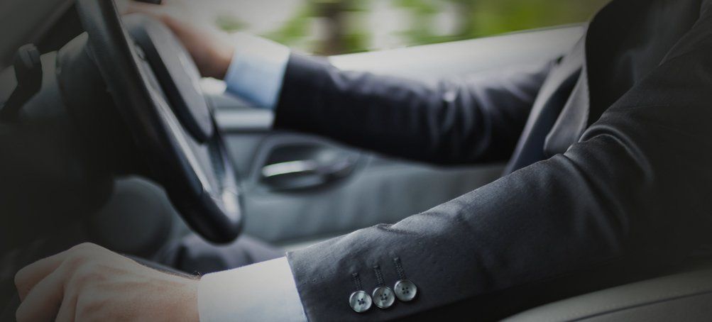 Executive driving a car