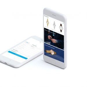 Ein Mobiltelefon mit einer Uhr auf dem Bildschirm neben einem anderen Mobiltelefon