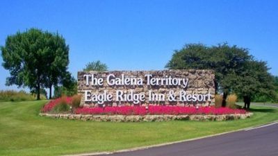 Sign for The Galena Territory Eagle Ridge Inn & Resort with blue sky and landscaping.