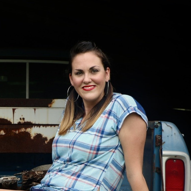 Picture of Elyse Johnson Sitting on a Truck