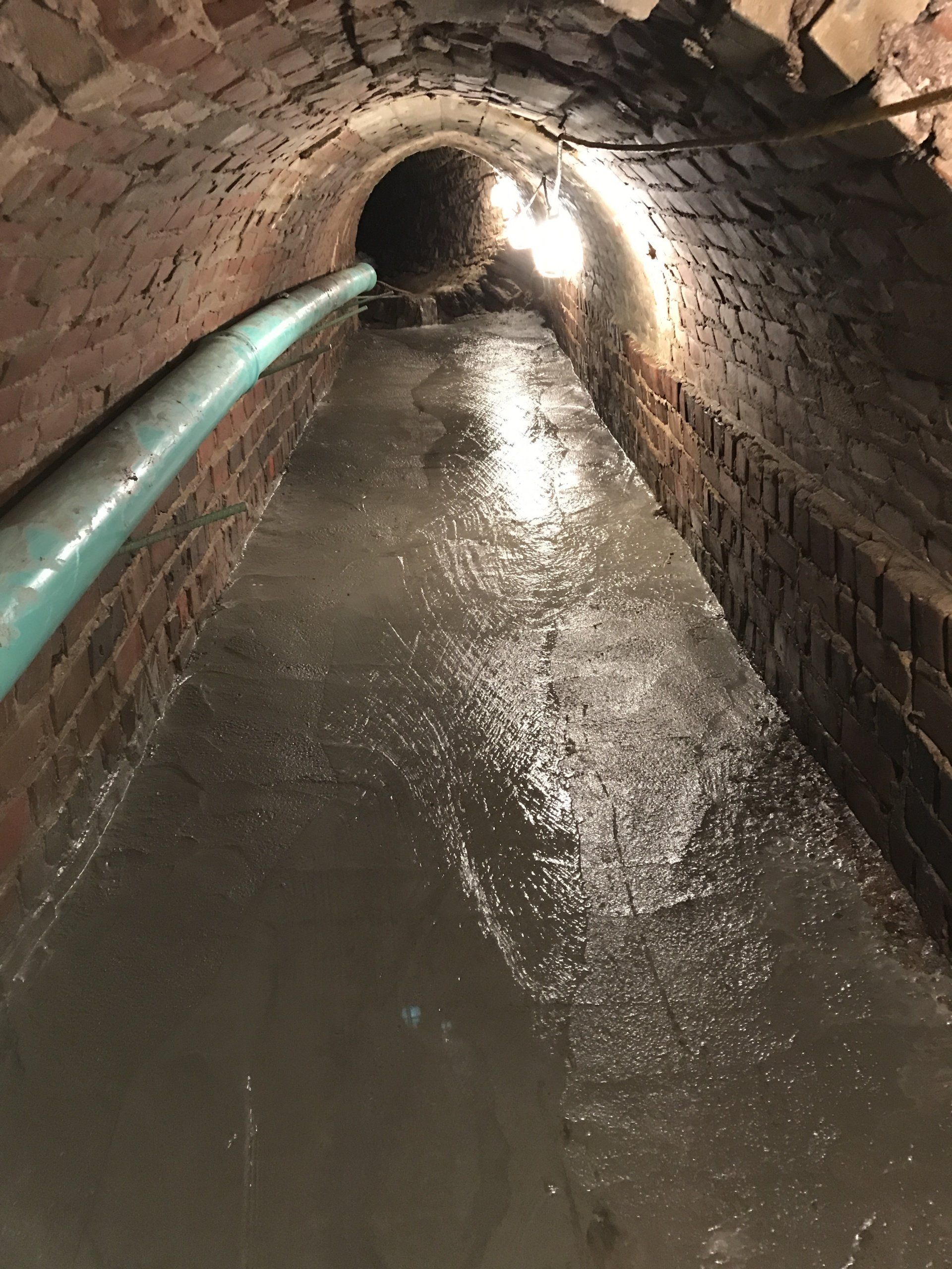 Lewis Street Brick Storm Repairs Before - Hand point repair brick and pour concrete invert on 66