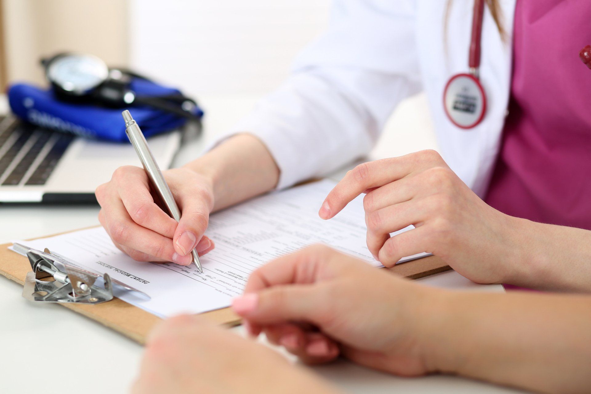 Doctor Writing on a Form — Charleston, WV — H. Richard Reynolds, M.D.