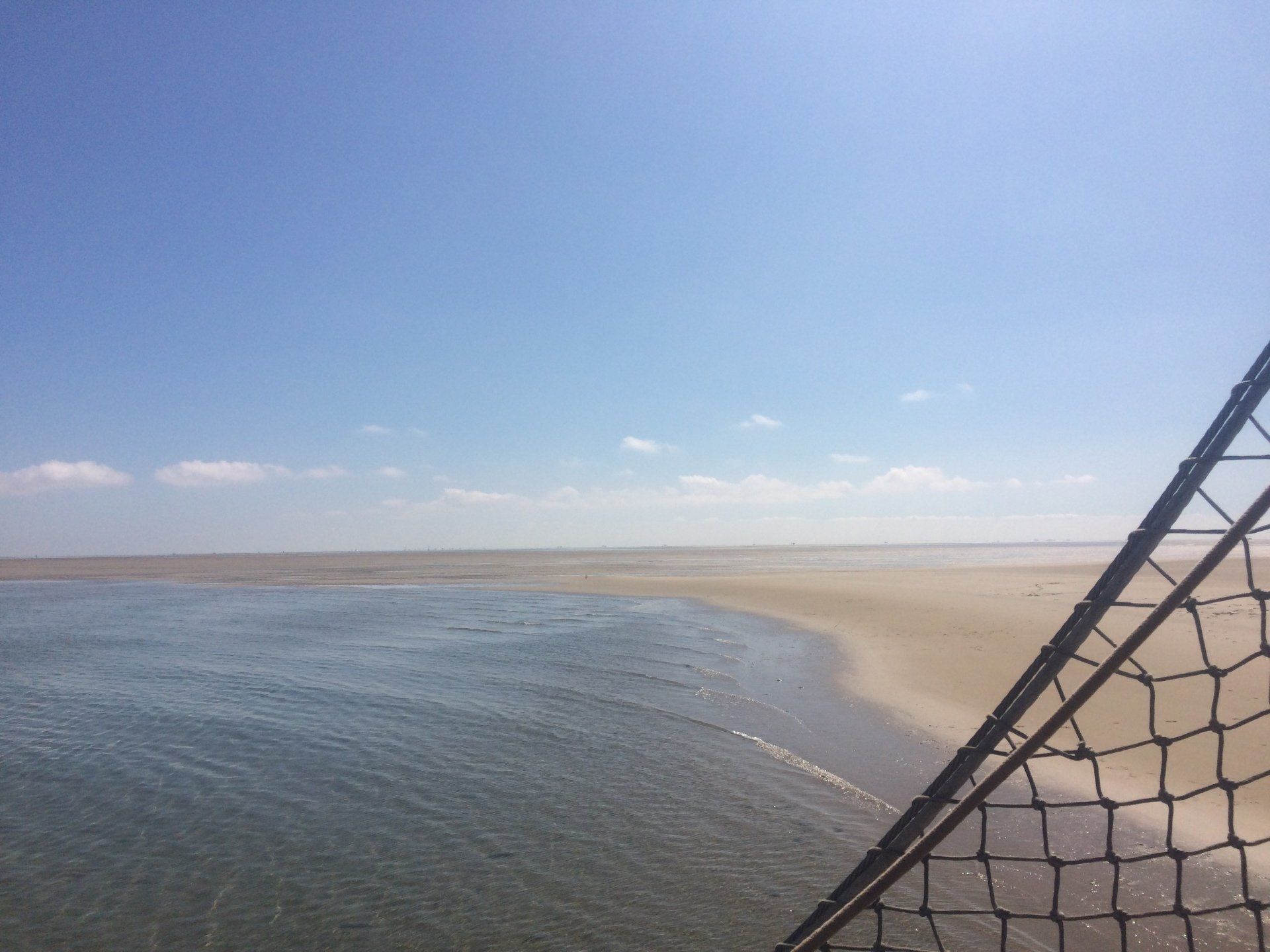 Wide Wadden Sea sandbank at low tide with an open view across the Dutch tidal flats.