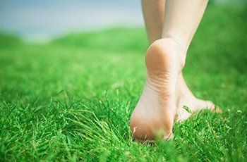 Woman legs on green grass Woman legs on green grass