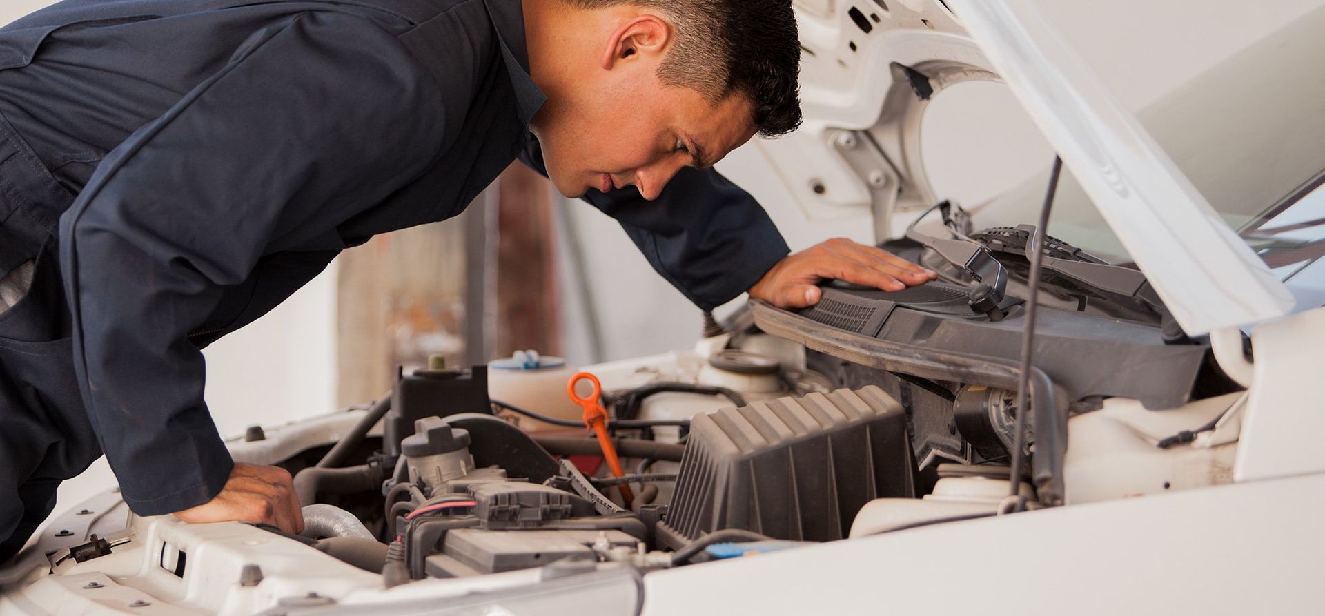 Mechanic taking a look at the car problem