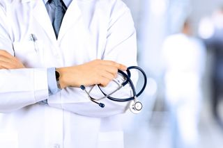 Doctor — Pediatrician Checking Child's Mouth in Panama City, FL Doctor — Pediatrician Checking Child's Mouth in Panama City, FL