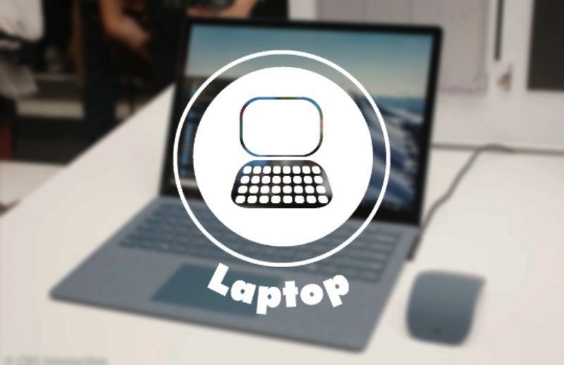 Laptop icon over a blurred open laptop on a desk, with the word “Laptop” below