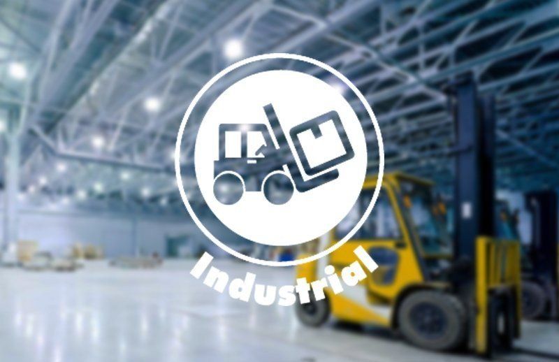 Forklift in a warehouse with a white “industrial” icon overlay