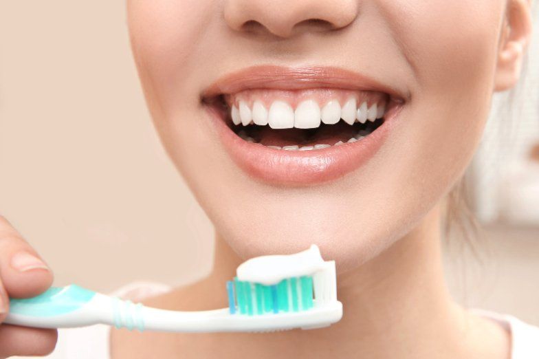 woman with gums and toothpaste