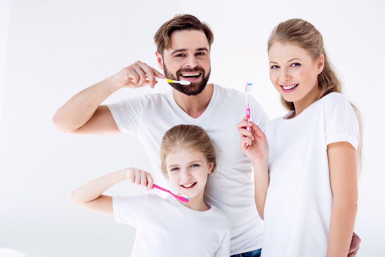 Happy Family dental cleaning their teeth after a visit to Kipnis Dental