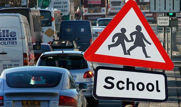 A picture of heavily congested road on the school run, causing pollution