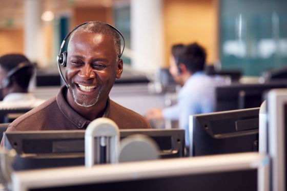 Man working in a call center — Mission, KS — AIH Receivables Man working in a call center — Mission, KS — AIH Receivables