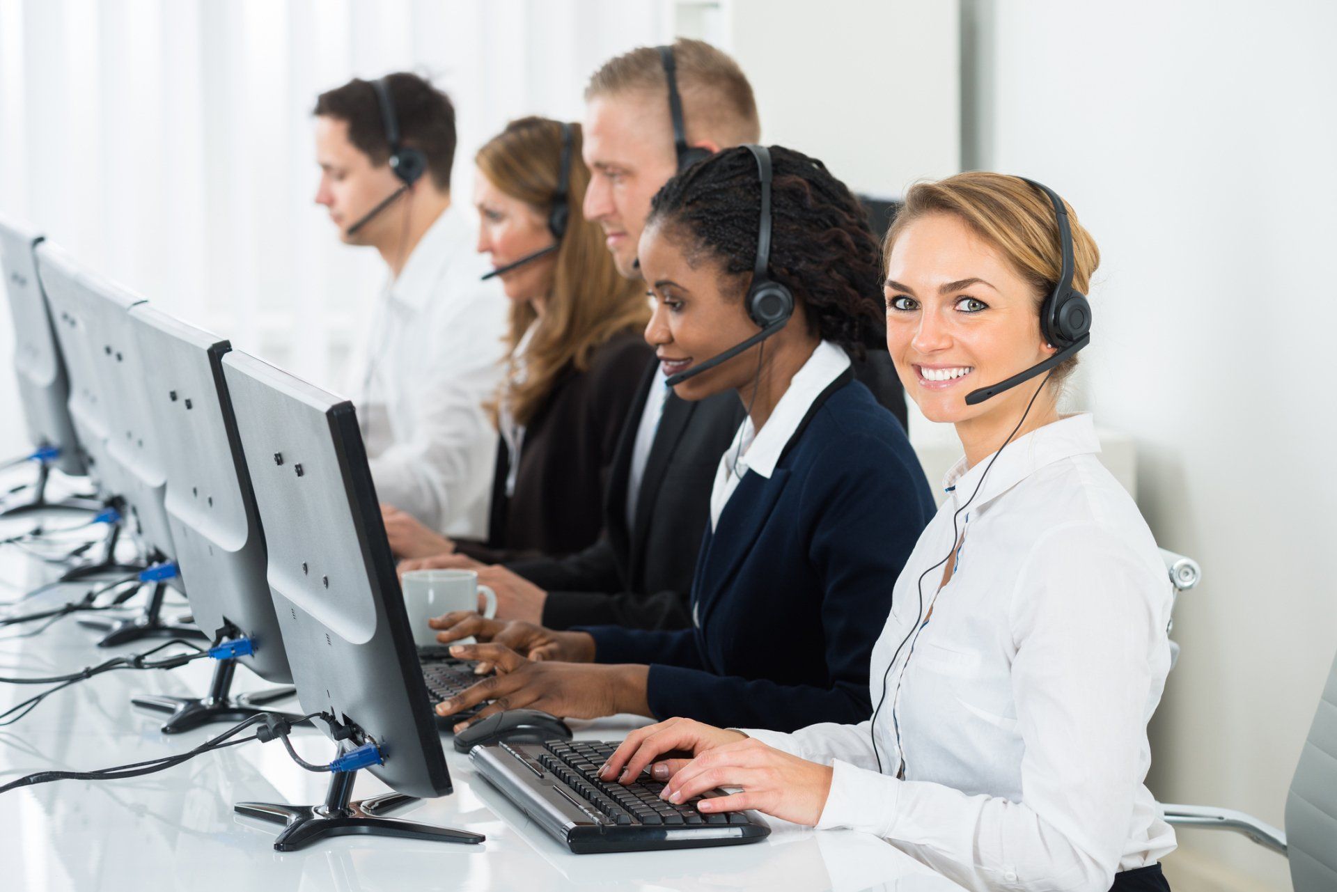 Working with team in call center — Mission, KS — AIH Receivables Working with team in call center — Mission, KS — AIH Receivables