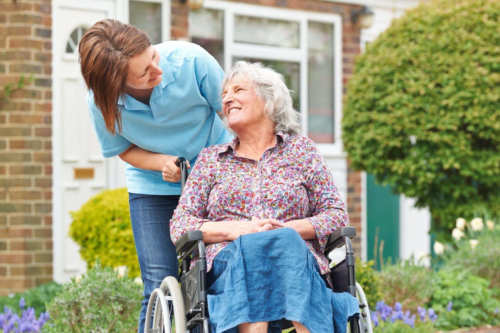 Caretaker and senior outside spring day