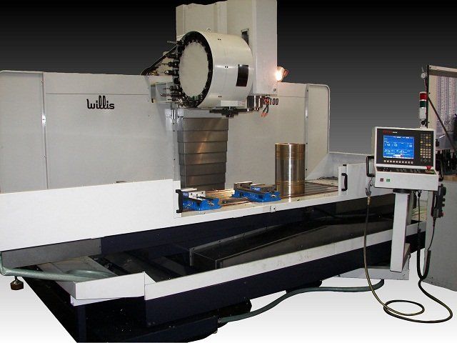 White industrial milling machine with a control panel and metal components.