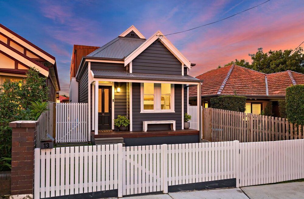 Gorgeous small home with white picket fencing