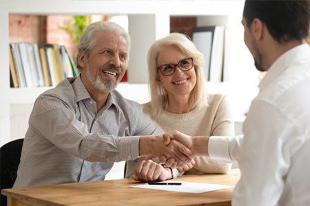 Senior Couple Shaking Hands With the Attorney — Pittsfield, MA — Drennan Law Offices