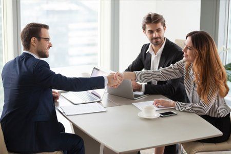 Businesswoman Shaking Hands With a Business Partner — Pittsfield, MA — Drennan Law Offices